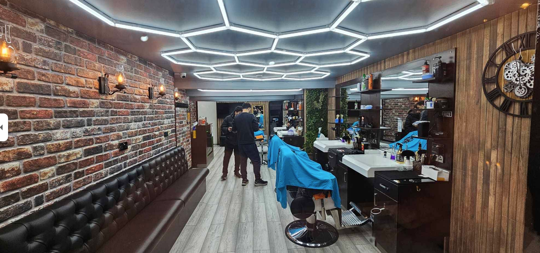 Interior of Golden Scissors with leather chairs and brass mirrors